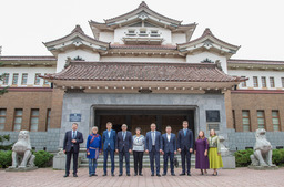 Photo for memory. Vsevolod Cherepanov, General Director of Gazprom Nedra LLC, and members of the Company's delegation with participants in the signing of additional agreements in front of the Sakhalin Regional Museum of Local Lore, History and Economy.