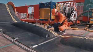 Oil-gathering equipment being deployed